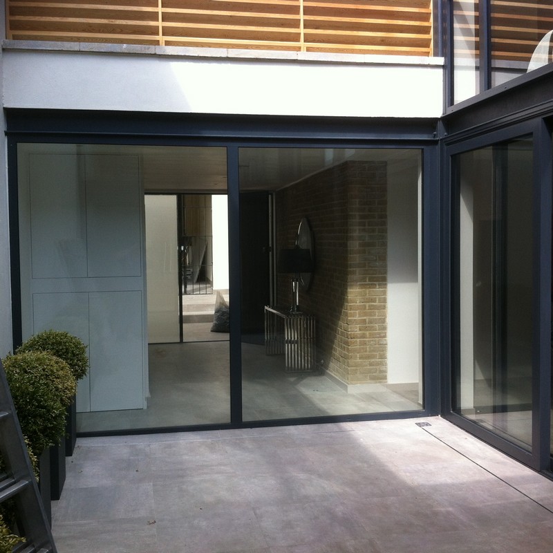 Floor-to-ceiling sliding doors opening to courtyard in Ladbroke Grove