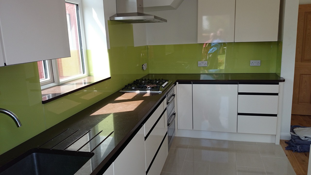 Lime green glass kitchen splashback installed by Ladbroke Grove glaziers